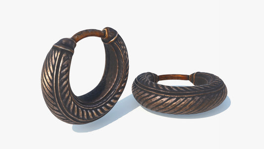 3D model of an ancient earing loop. It's made of antique gold and has a simple design with geometrical patterns along the loop. The model has low polycount and PBR shading, perfect for games