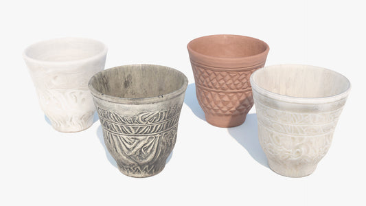3D model of four ornamental rustic cups made of clay, ceramic, marble, and carved bone. Lowpoly and PBR textures make them game ready and perfect for the metaverse