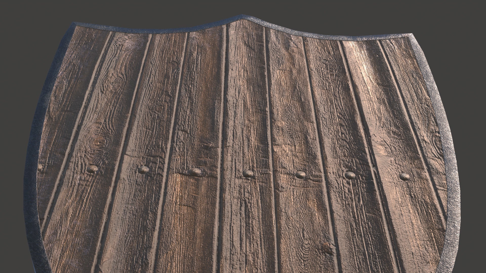 Wooden shield with a dark brown finish on a black background