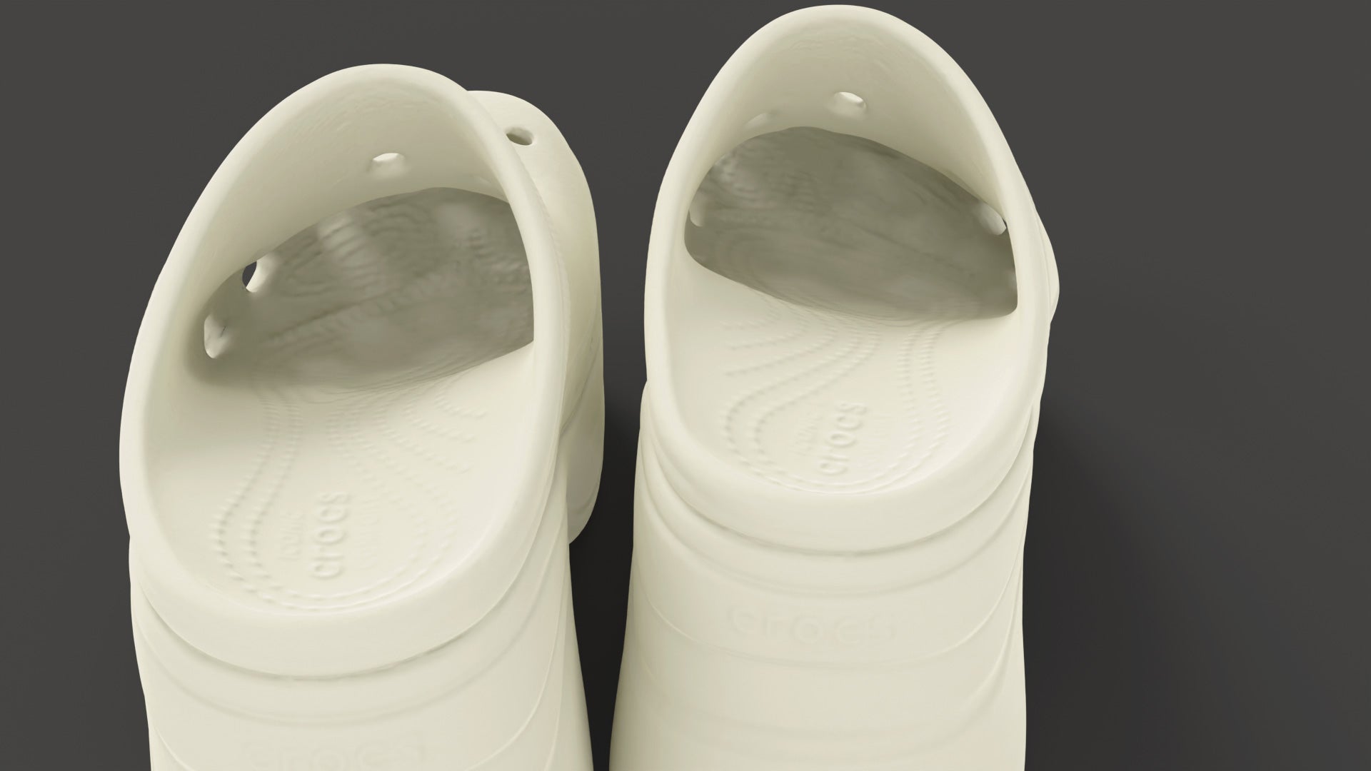 A 3d model of a pair of siren clogs crocs shoes seen from behind, were the details and bumps of the sole can be appreciated